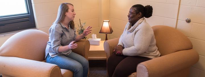 A PFW counseling student works with a client in the counseling center.